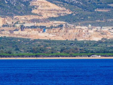 View from the sea of the marble quarry near Orosei in Sardinia, Italy clipart