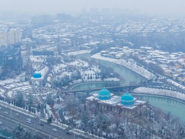 City aerial view from the top of the Tashkent Tower in winter clipart