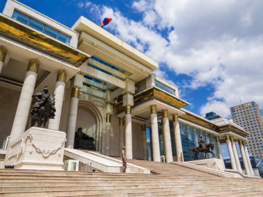 Ulaanbaatar, Mongolia - May 25, 2024: View of the Parliament of Mongolia and the Chinggis Khan statue in Sukhbaatar square.