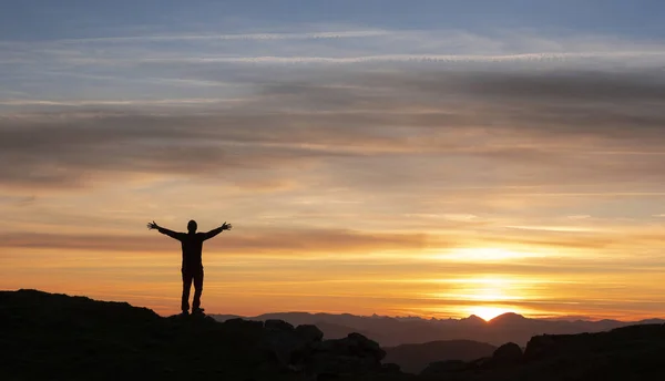 Mountaineer watching the sunrise on Mount Jaizkibel