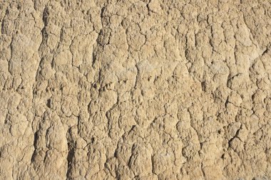 Texture of sandstone rock with cracks in the desert.
