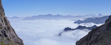 Sea of clouds on the Col de Petrechema, cirque de Lescun, France clipart