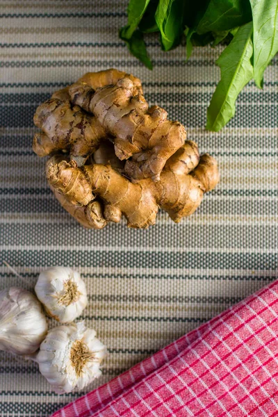 stock image fresh ginger root on a wooden background