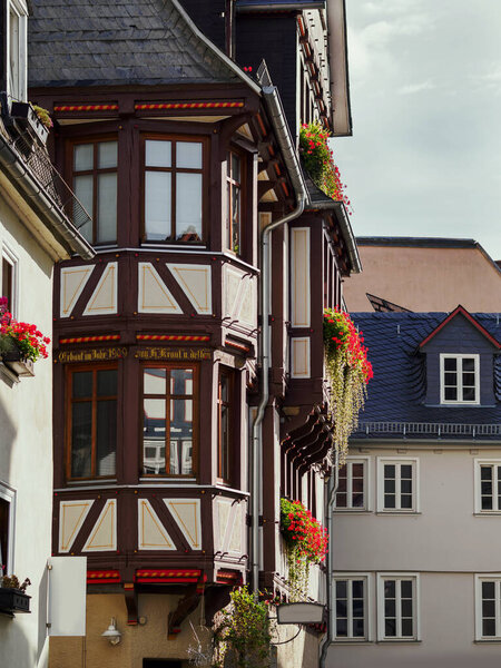During the day, sunny, house views of old town Marburg, half-timbered buildings, balconies