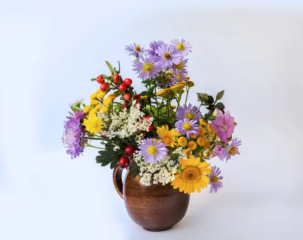 bouquet of flowers in a vase with a bouquet on a white background.
