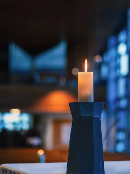 candles in the church, Candle on stand interior bokeh