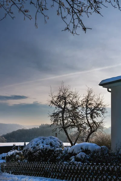 Winter weather, snow on forests and roofs, Marbach Ketzerbach