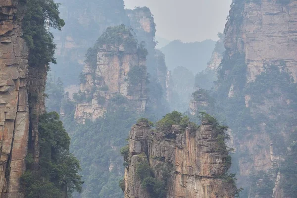 Zhangjiajie National Forest Park is one of Chinas, most breathtaking scenic areas. Situated in Hunan Province, the park is known for its huge sandstone pillars formed by many years of water erosion.