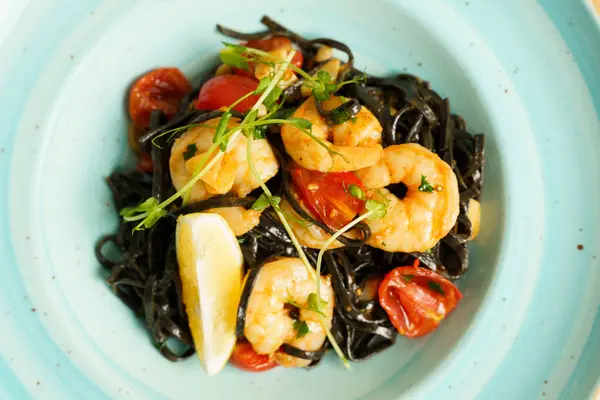Black tagliatelle pasta with shrimp, chili and garlic
