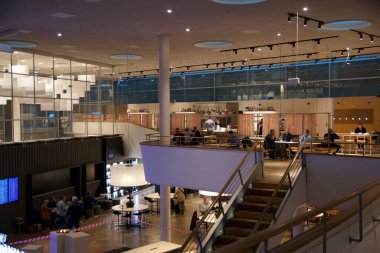 Copenhagen, Denmark, November 24, 2018: Overview of the Frequent Flyer Lounge from the Second Floor. clipart