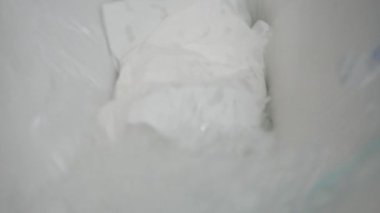 A Person Throws Toilet Paper into the Toilet and Flushes the Water. Man Using a Public Toilet.