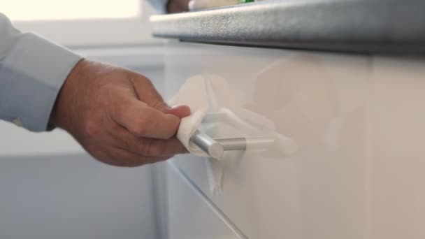 Man Cleaning Sanitizing Kitchen Furniture Disinfecting Surface Closet Wipe Cleaning — Stockvideo