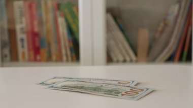 Blurred Shooting with a Man Counting Cash Money, Calculating Salary Payments, and Paying in Cash. Financial Investments Concept.