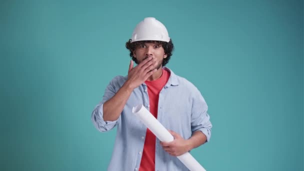 Young Indian Arabic Engineer Standing Holding Helmet Blueprint Wearing Ear — Stock Video