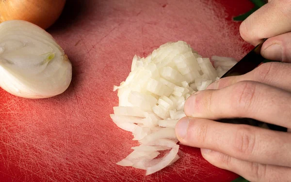 stock image Chopped onion on the table. Cooking a side dish