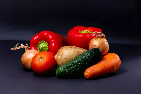 stock image different vegetables isolated on dark background