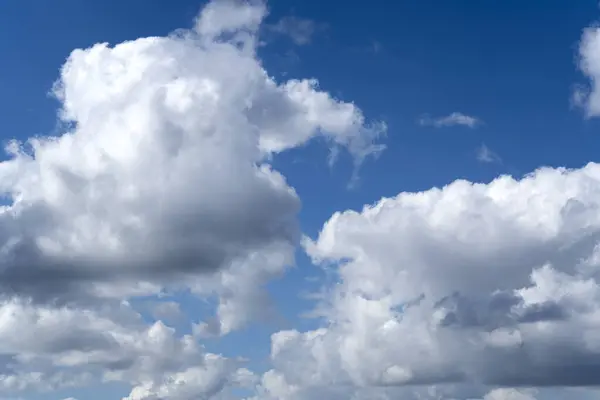 stock image Sunny blue sky with clouds. Clouds move smoothly across the sky