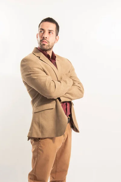 stock image Portrait of a executive latino man with arms crossed, wearing a brown suit