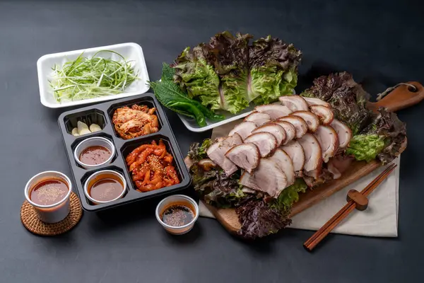 stock image Jokbal, bossam, Korean food, braised pork, makguksu, hwangtae, slush, muksabal, side dishes, salted shrimp, lettuce,