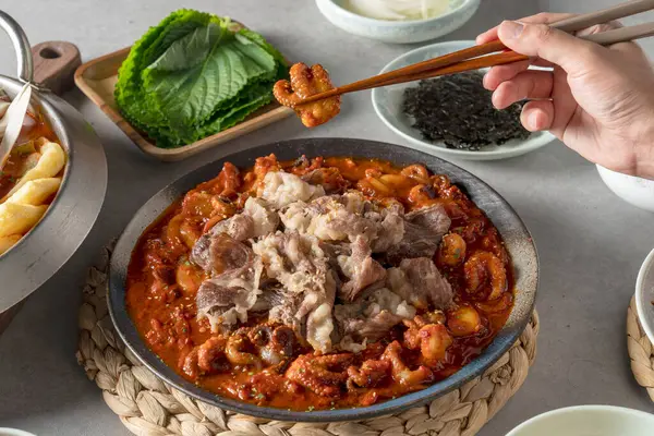 stock image Korean, webfoot octopus, stir-fried, spicy, back ribs, steamed, bulgogi, white rice, side dishes, lettuce, garlic, kimchi