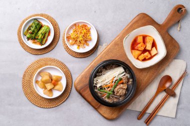 Korean food, budae jjigae, galbitang, earthen pot, bulgogi, pork belly, grilled, side dishes, kimchi, cucumbers, potatoes, vegetables clipart