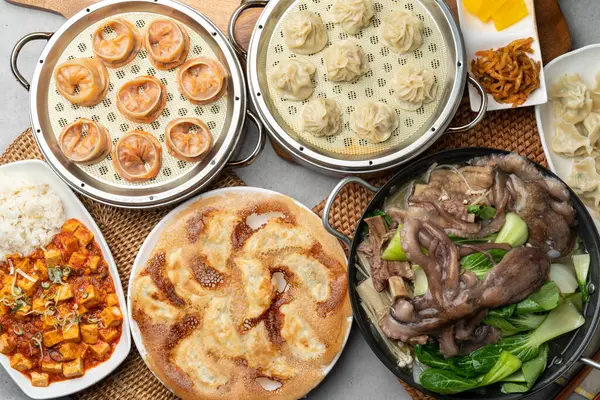 stock image Korean food, shrimp, meat, dumplings, kimchi, xiaolongbao, mapa tofu rice, ribs, octopus, hot pot, side dishes, pickled radish