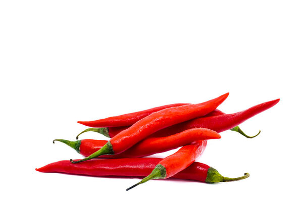 Red chili peppers isolated on white background with copy space. Ripe chili peppers, raw food ingredient concept.