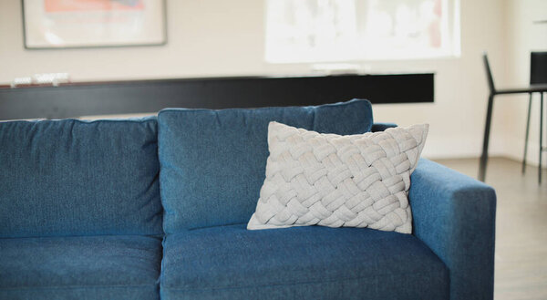 interior view of modern living room with sofa and pillows
