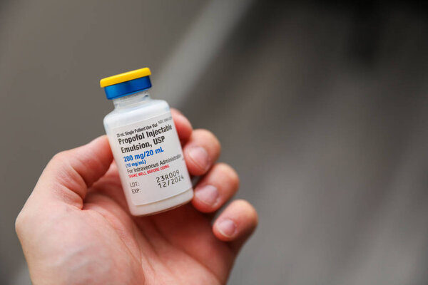 close - up of hand holding medicine pills