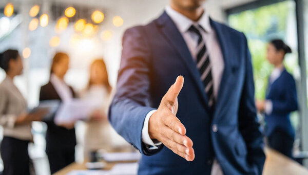 business people shaking hands in office.