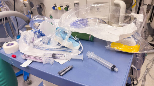 close-up of a medical syringe filled with clear liquid, resting on a sterile surface in a hospital environment. Symbolizing healthcare, medicine, and treatment, it represents precision, care, and healing