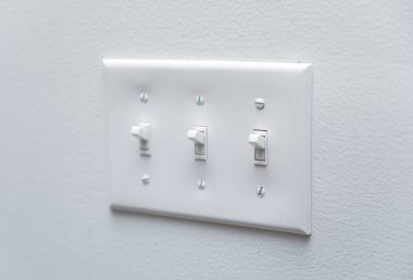 white electric socket on a wall