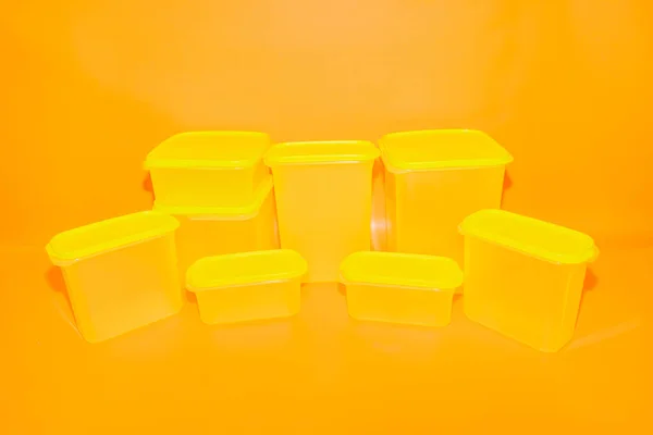 Yellow Plastic Box Jar Set Various Sizes Offers Versatile Storage — Stock Photo, Image
