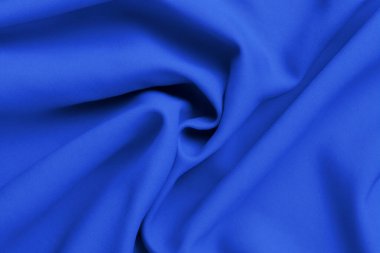 blue satin fabric texture background. wavy fabric texture.