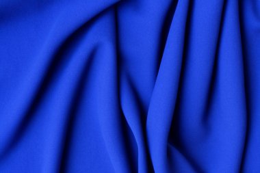 blue silk fabric texture, background. blue fabric is painted, studio.