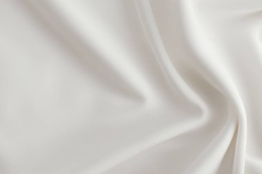 smooth elegant white silk or satin luxury cloth texture can use as wedding background. luxurious christmas new year design background