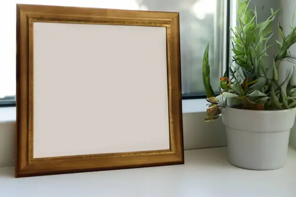 blank frame mockup on white wall background with copy space.