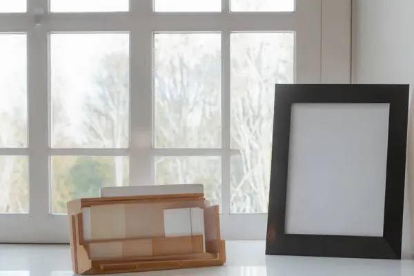 photo frames on wooden background in the room, interior design, empty photo frames.