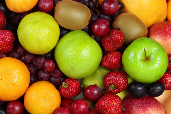 background of fresh ripe fruits. healthy food, diet concept
