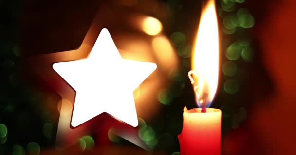 Frohe Weihnachten Hintergrund Mit Schönen Funkelnden Goldstern Mit Kerze Vordergrund — Stockvideo