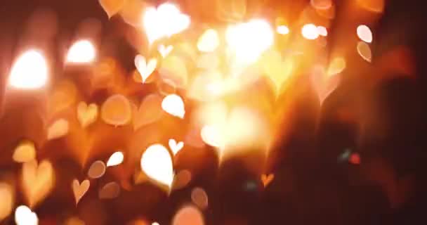 Glödande Hjärta Bokeh Effekt Svart Bakgrund Romantisk Abstrakt Rörelse Bakgrund — Stockvideo