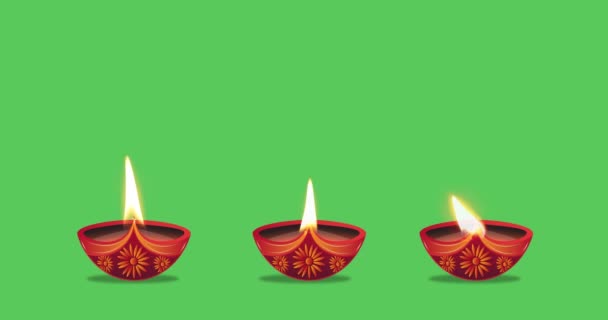 Масляні Лампи Горять Трьома Різними Способами Зеленому Тлі Святкування Дівалі — стокове відео