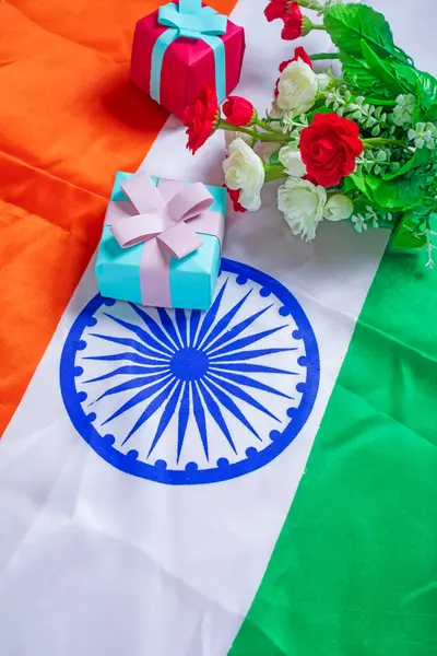 stock image Indian flag with gift box and flowers on Indian flag background for Independence day. Top view