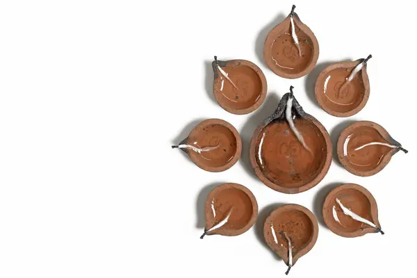 stock image Hindu traditional clay diya arrangement for Diwali celebration on white background with copy space for text. It is used during Diwali, Karthigai Deepam and other Indian festivals.