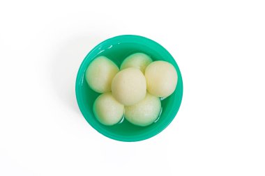 A top view of traditional Indian rasgulla served in a green plastic bowl on white background. Ideal for Indian festive designs. clipart