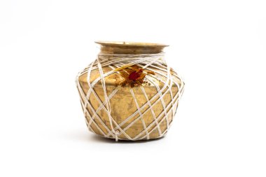 A traditional golden brass pot adorned with white strings and red ritual powder, isolated on a white background. Perfect for cultural, artistic, and heritage presentations. clipart