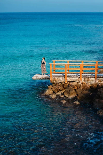 Caucasian Young Woman Sunglasses Summer Dress Standing Wooden Pier Rough — Stockfoto