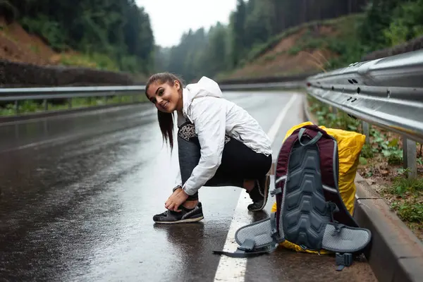 Hiker Young Woman Yellow Backpack Tying Laces Nature Outdoors Happy — 图库照片