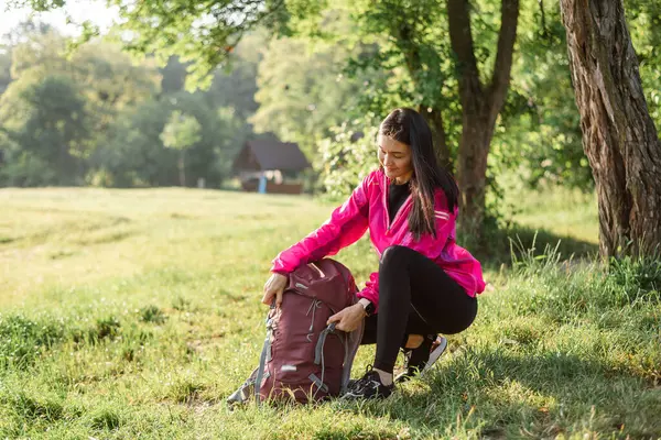 Young European Woman Opening Her Backpack Green Meadow Forest Beautiful — Stock Photo, Image
