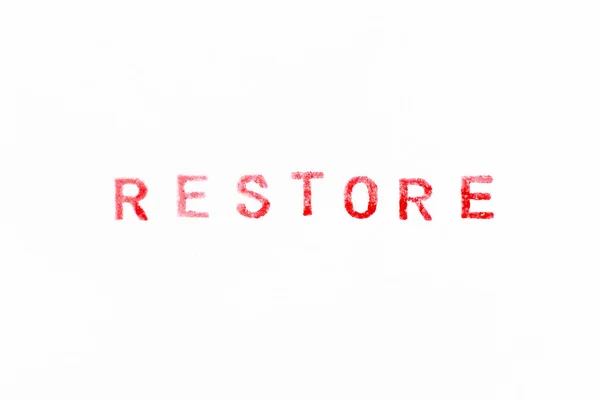 白い紙の背景に単語の復元で赤い色のインクゴムスタンプ — ストック写真